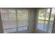 These windows feature blinds and provide a view of the outdoors, enhancing the space's natural light at 1006 39Th W Ave, Bradenton, FL 34205