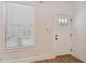 Bright entryway with a white door and window with blinds at 3810 N Arlington Ave, Tampa, FL 33603