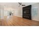 Spacious living room with hardwood floors, fireplace, and an open floor plan at 3810 N Arlington Ave, Tampa, FL 33603