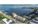 Condo building situated on waterfront with boats and bridge at 100 Bluff View Dr # 607A, Belleair Bluffs, FL 33770