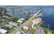 Aerial view of waterfront property with bridge, residential buildings, and boats at 100 Bluff View Dr # 607A, Belleair Bluffs, FL 33770
