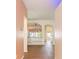 Bright and airy entryway with tile flooring, archways and built-in shelving at 422 Down Pine Dr, Seffner, FL 33584