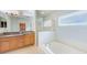 Bathroom with double sinks, tub, and shower at 422 Down Pine Dr, Seffner, FL 33584