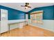 Home office with wood floors and built-in desk at 422 Down Pine Dr, Seffner, FL 33584