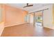 Gathering room with tile floors, sliding doors to patio, and access to kitchen at 422 Down Pine Dr, Seffner, FL 33584