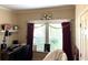 Bedroom with a keyboard and shelf for decorations and a window decorated for a birthday at 8529 Kenton Rd, Wesley Chapel, FL 33545