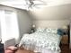 Bright bedroom featuring wood floors, white walls, a ceiling fan and lots of natural light at 8529 Kenton Rd, Wesley Chapel, FL 33545