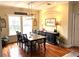 Formal dining area with hardwood floors and elegant decor at 8529 Kenton Rd, Wesley Chapel, FL 33545