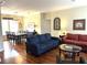 Open-concept living room with hardwood floors and comfortable seating area at 8529 Kenton Rd, Wesley Chapel, FL 33545