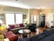 Inviting living room featuring hardwood floors and abundant natural light at 8529 Kenton Rd, Wesley Chapel, FL 33545