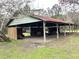 Outdoor pavilion with metal roof, picnic tables, chairs, and string lights, perfect for entertaining at 8529 Kenton Rd, Wesley Chapel, FL 33545