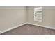 Spacious bedroom with neutral walls and carpet flooring at 3721 Wiggins Leaf St, Tampa, FL 33619