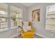 Cozy reading nook with yellow armchair and natural light at 3721 Wiggins Leaf St, Tampa, FL 33619