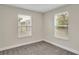 Spacious bedroom with two windows and neutral tones at 3721 Wiggins Leaf St, Tampa, FL 33619