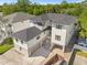 New construction features a dark roof, light exterior, and multiple garages at 4805 W San Rafael St, Tampa, FL 33629
