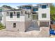 Contemporary two-story home features stone accents, black trim, and a multi-car garage at 4805 W San Rafael St, Tampa, FL 33629