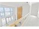 Upstairs interior view of the home construction showing high ceilings and large windows at 4805 W San Rafael St, Tampa, FL 33629