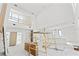 An interior view of a modern home under construction with tall ceilings and ample natural light at 4805 W San Rafael St, Tampa, FL 33629