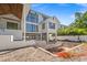 Modern design featuring a two-story home, large windows, and outdoor living space for a seamless indoor-outdoor experience at 4805 W San Rafael St, Tampa, FL 33629