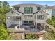 Modern two-story home featuring a pool, covered patio and large windows for ample natural light and outdoor living at 4805 W San Rafael St, Tampa, FL 33629