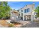 Bright white two-story home design featuring large windows and a patio area perfect for outdoor entertaining and relaxation at 4805 W San Rafael St, Tampa, FL 33629