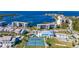 Aerial of waterfront community featuring tennis courts and pool at 8251 Brent St # 912, Port Richey, FL 34668