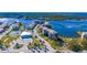 Aerial view of waterfront community with tennis courts and pool at 8251 Brent St # 912, Port Richey, FL 34668