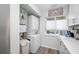 Stackable washer/dryer and water softener in a closet at 8251 Brent St # 912, Port Richey, FL 34668