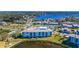 Aerial view of condo building near waterfront, tennis courts and pool at 8251 Brent St # 912, Port Richey, FL 34668