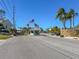 Gated community entrance with guard house and American flag at 8251 Brent St # 912, Port Richey, FL 34668