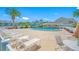 Community pool with plenty of lounge chairs for relaxing at 8251 Brent St # 912, Port Richey, FL 34668