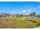 View of community featuring a putting green and tennis courts at 8251 Brent St # 912, Port Richey, FL 34668