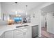 Kitchen with white cabinets, quartz countertops, and ocean view at 8251 Brent St # 912, Port Richey, FL 34668