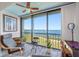 Sunroom boasting water views and comfortable seating at 8251 Brent St # 912, Port Richey, FL 34668