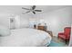 Main bedroom with king-size bed and ceiling fan at 8251 Brent St # 912, Port Richey, FL 34668