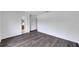 Bright bedroom featuring wood-look floors and access to a bathroom at 12950 Fennway Ridge Dr, Riverview, FL 33579