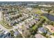 Aerial view showing the house's location within a community with a lake at 12950 Fennway Ridge Dr, Riverview, FL 33579