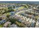 Aerial view of the house and surrounding neighborhood near a golf course at 12950 Fennway Ridge Dr, Riverview, FL 33579