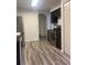 Modern kitchen with stainless steel appliances and dark wood cabinets at 12950 Fennway Ridge Dr, Riverview, FL 33579