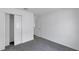 Bedroom with grey carpet, closet and door at 12950 Fennway Ridge Dr, Riverview, FL 33579