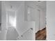 Upstairs hallway with stairs and doors to bedrooms at 12950 Fennway Ridge Dr, Riverview, FL 33579