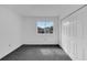 Bright bedroom with grey carpet and window at 12950 Fennway Ridge Dr, Riverview, FL 33579