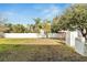 Fenced-in backyard with grassy area and white privacy fence at 12950 Fennway Ridge Dr, Riverview, FL 33579