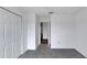 Spacious bedroom with grey carpet and closet at 12950 Fennway Ridge Dr, Riverview, FL 33579