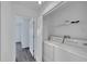 Laundry room with washer, dryer and shelving at 12950 Fennway Ridge Dr, Riverview, FL 33579