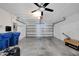 Attached garage with ceiling fan and storage at 12950 Fennway Ridge Dr, Riverview, FL 33579