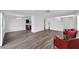 Open concept living and dining area with gray vinyl flooring at 12950 Fennway Ridge Dr, Riverview, FL 33579