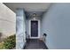 Small front porch with two chairs, offering a welcoming entryway at 12950 Fennway Ridge Dr, Riverview, FL 33579