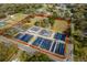 Aerial view of a large lot with greenhouses and surrounding land at 10521 County Road 579, Thonotosassa, FL 33592