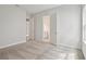 Spacious bedroom featuring neutral carpeting and an open doorway to the en-suite bathroom at 17721 Roost Pl, Lakewood Ranch, FL 34211